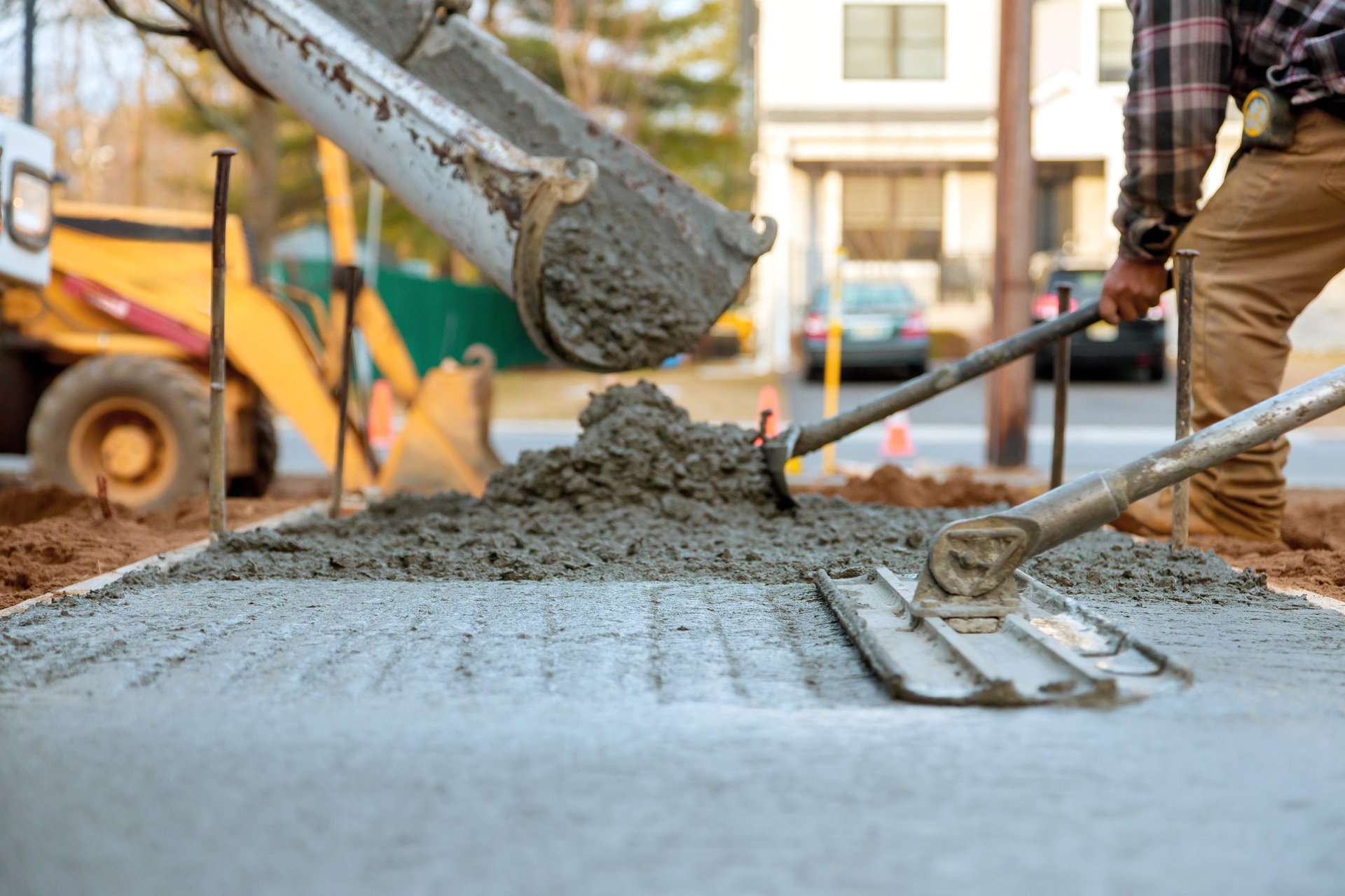 Construction work - workers pouring concrete
