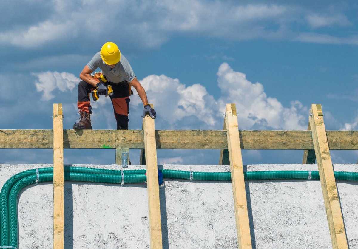 Skilled craftsman working on roof structure